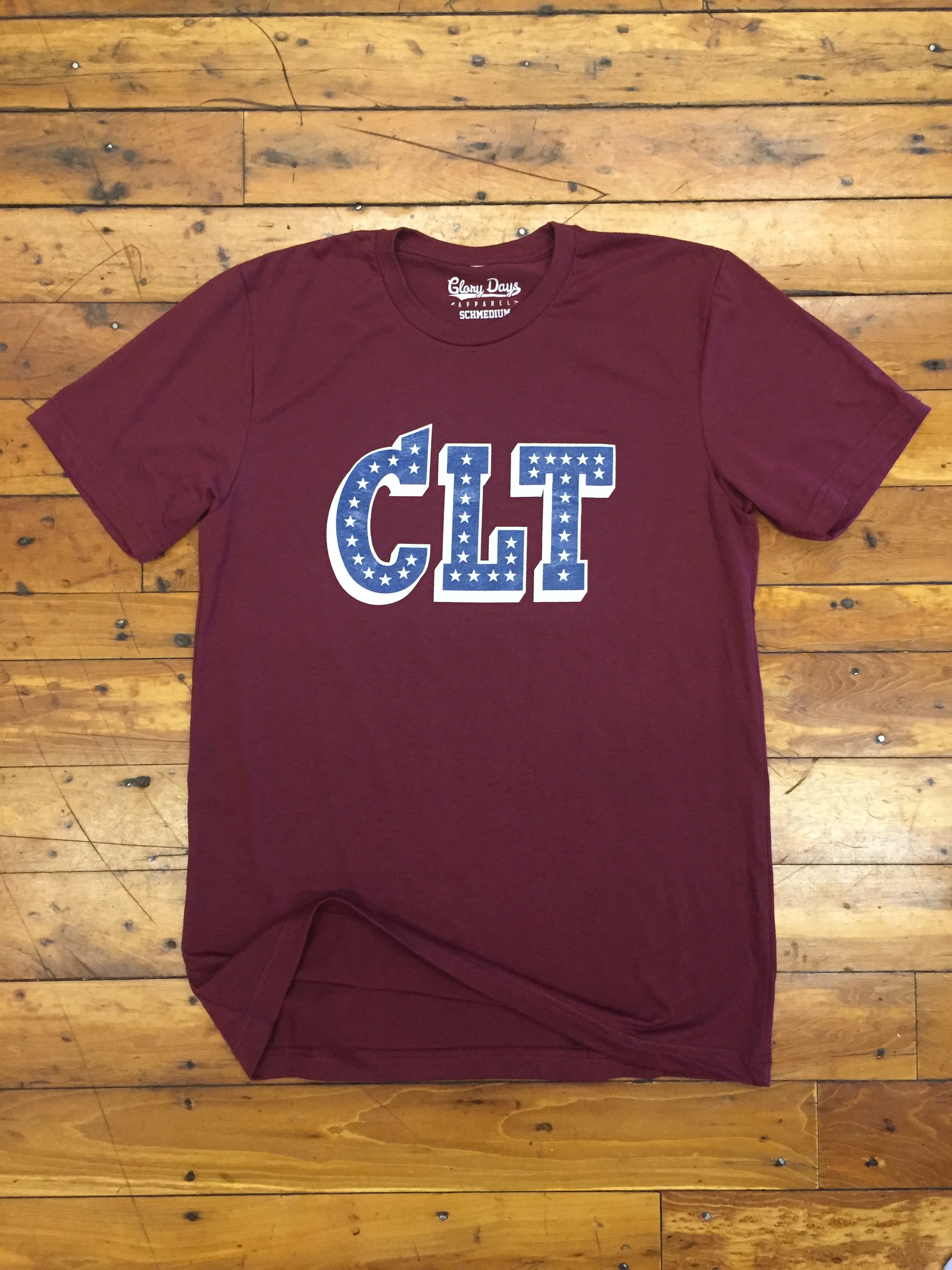 CLT custom screen printed maroon t-shirt flat lay