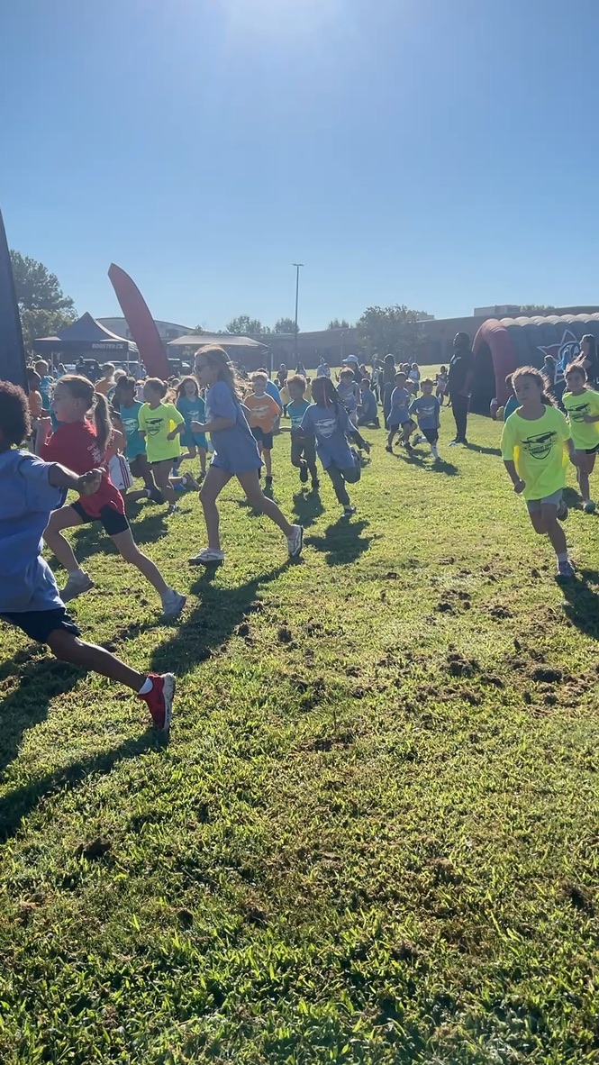 Kids running at a school event in custom printed shirts